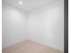 Simple bedroom with light hardwood floors and bright white walls at 260 Deer Isle Dr, Winter Garden, FL 34787
