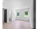 Spacious bedroom with hardwood floors, attached bathroom and large windows at 260 Deer Isle Dr, Winter Garden, FL 34787