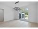 Modern dining room with large window, hardwood floors, and stylish light fixture at 260 Deer Isle Dr, Winter Garden, FL 34787