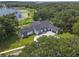 Lakefront home with a large yard and circular driveway at 260 Deer Isle Dr, Winter Garden, FL 34787