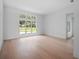 Spacious living room with hardwood floors and large windows at 260 Deer Isle Dr, Winter Garden, FL 34787
