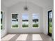 Bright living room with lake views and hardwood floors at 260 Deer Isle Dr, Winter Garden, FL 34787