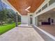 Covered patio with wood ceiling, sliding doors to kitchen, and a view of the backyard at 260 Deer Isle Dr, Winter Garden, FL 34787