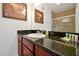 Bathroom with granite countertop and a walk-in shower at 1375 Tuscana Ln # 1308, Davenport, FL 33896