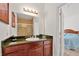 Bathroom with granite countertop and a view of the bedroom at 1375 Tuscana Ln # 1308, Davenport, FL 33896