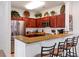 Well-equipped kitchen with granite counters and wood cabinets at 1375 Tuscana Ln # 1308, Davenport, FL 33896