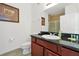 Bathroom with vanity, sink, shower, and toilet at 1375 Tuscana Ln # 1308, Davenport, FL 33896