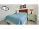 Bedroom with a queen bed, nightstands, and window at 1375 Tuscana Ln # 1308, Davenport, FL 33896
