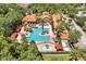 Resort-style pool with lounge chairs and cabanas at 1375 Tuscana Ln # 1308, Davenport, FL 33896