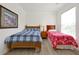 Bedroom with twin and full-size beds, nightstand, and window at 1375 Tuscana Ln # 1308, Davenport, FL 33896