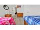 Bedroom with twin bed, dresser and view of living room at 1375 Tuscana Ln # 1308, Davenport, FL 33896