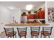Kitchen with granite countertops, stainless steel appliances, and a breakfast bar at 1375 Tuscana Ln # 1308, Davenport, FL 33896