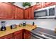 Kitchen corner with granite countertops and built-in appliances at 1375 Tuscana Ln # 1308, Davenport, FL 33896