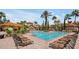 Relaxing community pool with plenty of lounge chairs at 1375 Tuscana Ln # 1308, Davenport, FL 33896