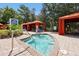 Relax in this community hot tub, nestled amongst lush landscaping and private cabanas at 1375 Tuscana Ln # 1308, Davenport, FL 33896