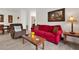 Living room with red couch and recliner at 1375 Tuscana Ln # 1308, Davenport, FL 33896