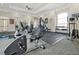 Well-equipped fitness center with various exercise machines at 1375 Tuscana Ln # 1308, Davenport, FL 33896