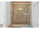 Clean shower with pebble flooring and glass enclosure at 1375 Tuscana Ln # 1308, Davenport, FL 33896