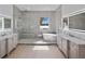 Luxurious bathroom with a soaking tub, large shower, and modern vanity at 260 Deer Isle Dr, Winter Garden, FL 34787