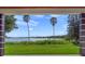 Lake view from covered patio, serene landscape at 260 Deer Isle Dr, Winter Garden, FL 34787