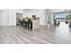 Modern kitchen with white cabinets, stainless steel appliances, and a large island at 1317 Spring Lake Ter, Ocoee, FL 34761