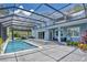 Expansive pool and patio area with screened enclosure at 1317 Spring Lake Ter, Ocoee, FL 34761