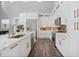 Bright kitchen with white cabinets, stainless steel appliances, and a large island at 1317 Spring Lake Ter, Ocoee, FL 34761