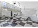 Spacious garage gym with various exercise equipment at 1317 Spring Lake Ter, Ocoee, FL 34761