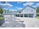 Stunning two-story home with a detached garage and driveway at 1317 Spring Lake Ter, Ocoee, FL 34761