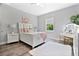 Bright bedroom with a white bed and vanity at 1317 Spring Lake Ter, Ocoee, FL 34761
