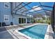 Large pool with screened enclosure and view of the house at 1317 Spring Lake Ter, Ocoee, FL 34761