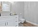 Clean bathroom with white vanity, toilet, and modern design at 1317 Spring Lake Ter, Ocoee, FL 34761