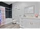 Stylish bathroom with a soaking tub, updated vanity, and grey tile at 1317 Spring Lake Ter, Ocoee, FL 34761