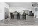 Open concept kitchen boasting white cabinets, a sizable island, and stainless steel appliances at 1317 Spring Lake Ter, Ocoee, FL 34761
