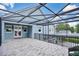Spacious screened deck with wood-look tile flooring at 1317 Spring Lake Ter, Ocoee, FL 34761