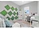 Home office with built-in shelving, desk, and comfortable seating at 1317 Spring Lake Ter, Ocoee, FL 34761