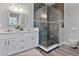 Elegant bathroom with double vanity, large shower, and modern fixtures at 1317 Spring Lake Ter, Ocoee, FL 34761