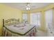 Bright bedroom with a floral comforter and ample natural light at 9656 Sw 93Rd Loop, Ocala, FL 34481
