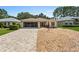 Single-story home with a paved driveway at 9656 Sw 93Rd Loop, Ocala, FL 34481