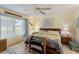 Relaxing Primary bedroom with a king-size bed and large windows at 9656 Sw 93Rd Loop, Ocala, FL 34481