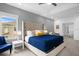 Spacious Primary bedroom with a large bed, seating area, and window at 3951 Oakville Ave, Kissimmee, FL 34741