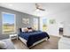 King-size bed in a bright bedroom with a ceiling fan at 3951 Oakville Ave, Kissimmee, FL 34741