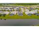 Aerial view of a waterfront community with houses and pools at 3951 Oakville Ave, Kissimmee, FL 34741