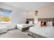 Two twin beds with Mickey Mouse decor in a bright bedroom with a window view at 3951 Oakville Ave, Kissimmee, FL 34741