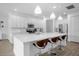 Bright kitchen with white cabinets, an expansive island, and stainless steel appliances at 3951 Oakville Ave, Kissimmee, FL 34741