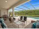 Relaxing pool area with covered patio and lounge seating at 3951 Oakville Ave, Kissimmee, FL 34741