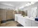 Primary bathroom with a double vanity and large shower at 3951 Oakville Ave, Kissimmee, FL 34741