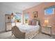 Charming bedroom with a soft color palette and plenty of natural light at 3951 Oakville Ave, Kissimmee, FL 34741