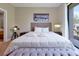 Bedroom with a queen bed and access to the backyard at 3112 Rockefeller Way, Kissimmee, FL 34747