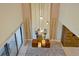 High-ceilinged living room with a fireplace and modern chandelier at 3112 Rockefeller Way, Kissimmee, FL 34747